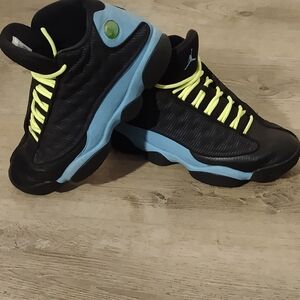 Jordan Black and Blue Athletic Shoes with Yellow Accents